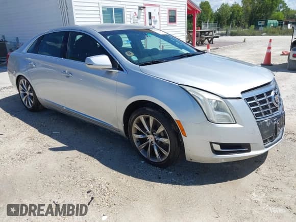 ✅ 2013 Cadillac XTS Livery • VIN: 2G61W5S38D9110591 • Lot: 43156880. Listed on IAAI with 420,217 mi. Free auction sales archive from the USA and detailed vehicle history report at DreamBid. Image 1.