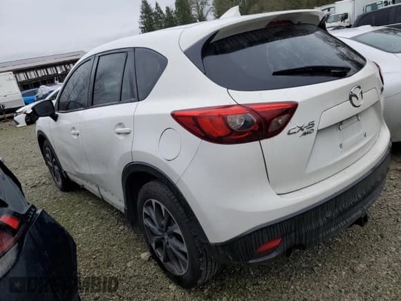 ✅ 2016 Mazda CX-5 Grand Touring • VIN: JM3KE4DY1G0803211 • Лот: 89537495. Опубликован ранее на Copart с пробегом 255 646 миль. Бесплатный доступ к архиву аукционных продаж из США и подробный отчёт об истории автомобиля на DreamBid. Изображение 2.