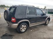 ✅ 2002 Kia Sportage • VIN: KNDJB723225136909 • Lot: 72007115. Listed on Copart with 107,720 mi. Free auction sales archive from the USA and detailed vehicle history report at DreamBid. Image 3.