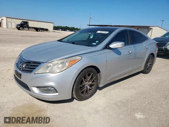 ✅ 2012 Hyundai Azera • VIN: KMHFH4JG8CA180568 • Лот: 71620145. Опубликован ранее на Copart с пробегом 192 343 миль. Бесплатный доступ к архиву аукционных продаж из США и подробный отчёт об истории автомобиля на DreamBid. Изображение 1.