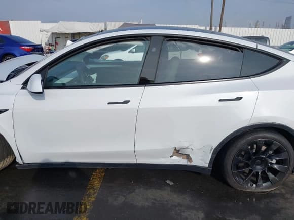 ✅ 2023 Tesla Model Y Long Range • VIN: 7SAYGDEE3PF900030 • Lot: 41147192. Listed on IAAI with 13,903 mi. Free auction sales archive from the USA and detailed vehicle history report at DreamBid. Image 13.