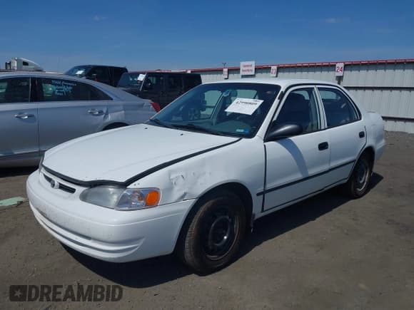 ✅ 2000 Toyota Corolla VE • VIN: 1NXBR12E0YZ410777 • Лот: 42990809. Опубликован ранее на IAAI с пробегом 214 737 миль. Бесплатный доступ к архиву аукционных продаж из США и подробный отчёт об истории автомобиля на DreamBid. Изображение 2.