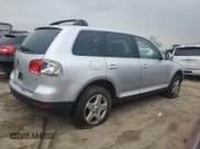 ✅ 2005 Volkswagen Touareg • VIN: WVGBG77L05D016935 • Lot: 49203584. Listed on Copart with 182,712 mi. Free auction sales archive from the USA and detailed vehicle history report at DreamBid. Image 3.