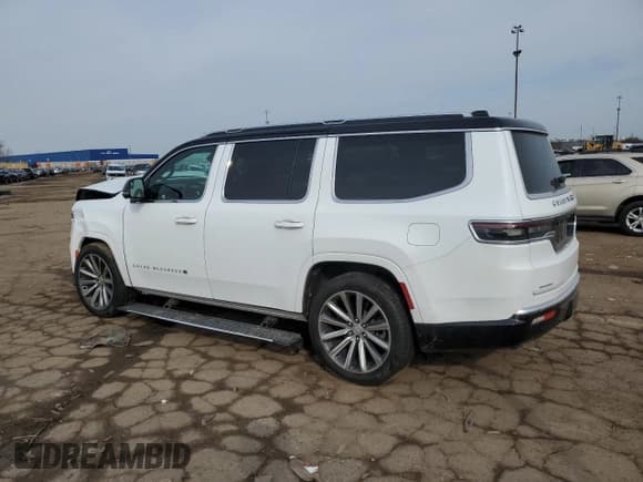 ✅ 2023 Jeep Grand Wagoneer • VIN: 1C4SJVEJ4PS550269 • Lot: 52693175. Listed on Copart with 9,915 mi. Free auction sales archive from the USA and detailed vehicle history report at DreamBid. Image 2.