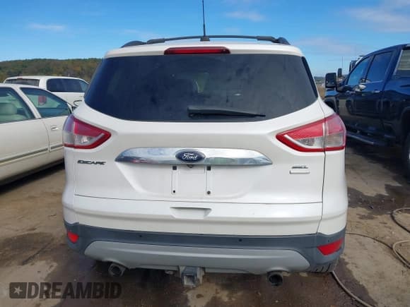 ✅ 2013 Ford Escape SEL • VIN: 1FMCU9H9XDUB07740 • Lot: 43454106. Listed on IAAI with 112,385 mi. Free auction sales archive from the USA and detailed vehicle history report at DreamBid. Image 16.