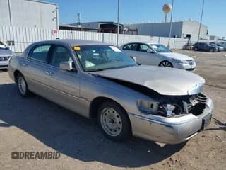 ✅ 2002 Lincoln Town Car Executive • VIN: 1LNHM81W72Y632938 • Lot: 43319981. Listed on IAAI with 126,825 mi. Free auction sales archive from the USA and detailed vehicle history report at DreamBid. Image 1.