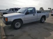 ✅ 1988 Mitsubishi Mighty Max • VIN: JA7FL24D2JP013297 • Lot: 79533724. Wystawiony na Copart z przebiegiem 117 397 mil. Bezpłatny archiwum sprzedaży aukcyjnych z USA i szczegółowy raport historii pojazdu na DreamBid. Zdjęcie 1.