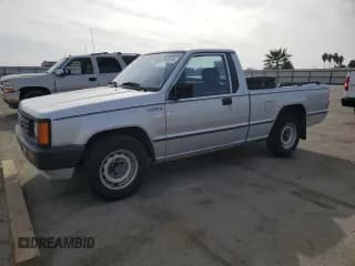 ✅ 1988 Mitsubishi Mighty Max • VIN: JA7FL24D2JP013297 • Lot: 79533724. Wystawiony na Copart z przebiegiem 117 397 mil. Bezpłatny archiwum sprzedaży aukcyjnych z USA i szczegółowy raport historii pojazdu na DreamBid. Zdjęcie 1.