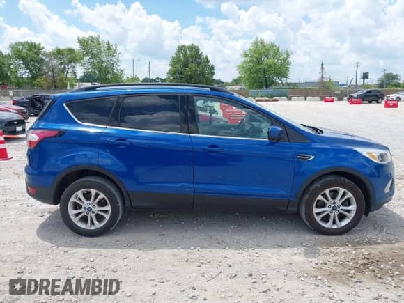 2018 Ford Escape SE z VIN 1FMCU9GD9JUA71170, wystawiony jako IAAI lot #42573258 z przebiegiem 102 170 mil mil oraz . Historia ofert i sprzedaży dostępna na DreamBid. Obrazek 13.