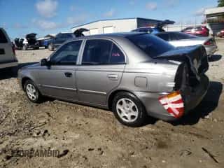 2004 Hyundai Accent GL z VIN KMHCG45C64U506817, wystawiony jako Copart lot #66365085 z przebiegiem 58 940 mil mil oraz Szkoda całkowita • Salvage title. Historia ofert i sprzedaży dostępna na DreamBid. Obrazek 2.