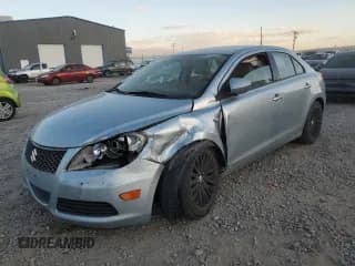 ✅ 2012 Suzuki Kizashi SE • VIN: JS2RE9A32C6100565 • Лот: 92511195. Опубликован ранее на Copart с пробегом 87 522 миль. Бесплатный доступ к архиву аукционных продаж из США и подробный отчёт об истории автомобиля на DreamBid. Изображение 1.