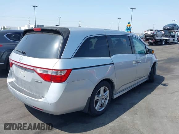✅ 2012 Honda Odyssey Touring • VIN: 5FNRL5H91CB004546 • Lot: 42175002. Listed on IAAI with 118,719 mi. Free auction sales archive from the USA and detailed vehicle history report at DreamBid. Image 4.
