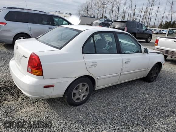 2003 Hyundai Accent GL z VIN KMHCG45C63U485420, wystawiony jako Copart lot #48251265 z przebiegiem 139 179 mil mil oraz Szkoda całkowita • Salvage title. Historia ofert i sprzedaży dostępna na DreamBid. Obrazek 3.