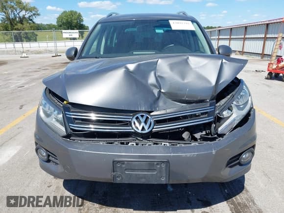 ✅ 2014 Volkswagen Tiguan S • VIN: WVGBV3AXXEW607031 • Lot: 43091792. Listed on IAAI with 139,222 mi. Free auction sales archive from the USA and detailed vehicle history report at DreamBid. Image 6.