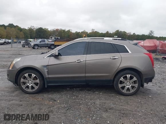 ✅ 2012 Cadillac SRX Premium Collection • VIN: 3GYFNCE31CS579748 • Lot: 43540223. Wystawiony na IAAI z przebiegiem 196 293 mil. Bezpłatny archiwum sprzedaży aukcyjnych z USA i szczegółowy raport historii pojazdu na DreamBid. Zdjęcie 14.