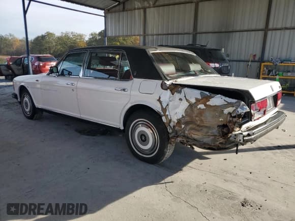 ✅ 1987 Rolls-Royce Silver Spur • VIN: SCAZN02A7HCX21836 • Лот: 82896744. Опубликован ранее на Copart с пробегом 102 544 миль. Бесплатный доступ к архиву аукционных продаж из США и подробный отчёт об истории автомобиля на DreamBid. Изображение 2.