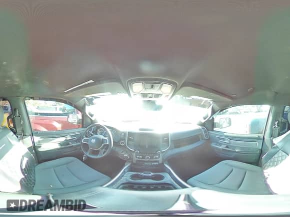 2023 Ram 1500 Lone Star with VIN 1C6RREMT8PN565793, listed as a Copart auction lot 77084184 with 18,825 mi miles and Salvage title. Bid and sale history available at DreamBid. Image 12.