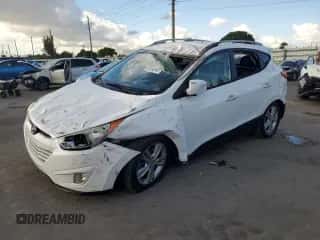 2013 Hyundai Tucson GLS with VIN KM8JU3AC6DU757207, listed as a Copart auction lot 89450945 with 164,630 mi miles and Salvage title. Bid and sale history available at DreamBid. Image 1.