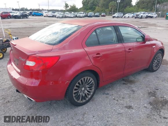 ✅ 2012 Suzuki Kizashi SE • VIN: JS2RE9A31C6101027 • Lot: 41213426. Listed on IAAI with 174,490 mi. Free auction sales archive from the USA and detailed vehicle history report at DreamBid. Image 4.