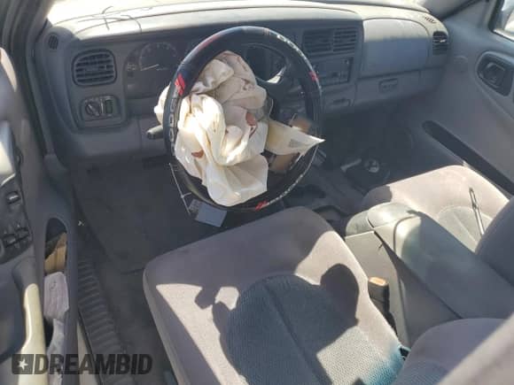 1999 Dodge Dakota SLT z VIN 1B7GL22Y6XS108819, wystawiony jako Copart lot #70400164 z przebiegiem Nie podano mil oraz Szkoda całkowita • Salvage title. Historia ofert i sprzedaży dostępna na DreamBid. Obrazek 8.