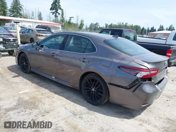 2021 Toyota Camry Hybrid XSE with VIN 4T1K31AK2MU559887, listed as a IAAI auction lot 42487632 with 24,069 mi miles and . Bid and sale history available at DreamBid. Image 3.