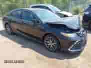 2022 Toyota Camry Hybrid XLE with VIN 4T1F31AK5NU585743, listed as a IAAI auction lot 42481083 with 44,161 mi miles and . Bid and sale history available at DreamBid. Image 1.