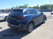 ✅ 2023 Mazda CX-5 S Carbon Edition • VIN: JM3KFBCMXP0282649 • Lot: 42784337. Listed on IAAI with 25,589 mi. Free auction sales archive from the USA and detailed vehicle history report at DreamBid. Image 4.