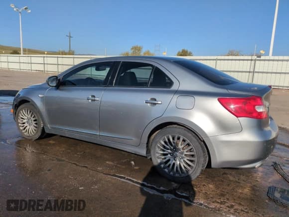 ✅ 2010 Suzuki Kizashi SLS • VIN: JS2RF9A79A6100169 • Lot: 52201835. Listed on Copart with 198,613 mi. Free auction sales archive from the USA and detailed vehicle history report at DreamBid. Image 2.
