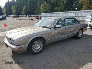 ✅ 1997 Jaguar XJ Vanden Plas • VIN: SAJKX6240VC801025 • Lot: 87301025. Listed on Copart with 188,594 mi. Free auction sales archive from the USA and detailed vehicle history report at DreamBid. Image 1.