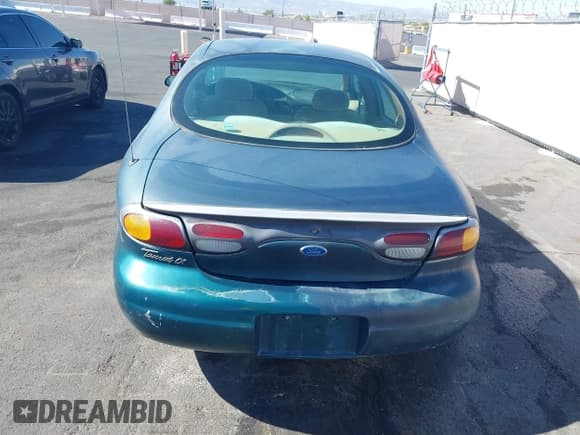 ✅ 1996 Ford Taurus LX • VIN: 1FALP53S0TG125665 • Лот: 42290691. Опубликован ранее на IAAI с пробегом 91 152 миль. Бесплатный доступ к архиву аукционных продаж из США и подробный отчёт об истории автомобиля на DreamBid. Изображение 14.