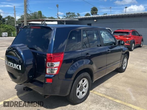 ✅ 2011 Suzuki Grand Vitara Premium • VIN: JS3TE0D23B4100407 • Lot: 71732535. Wystawiony na Copart z przebiegiem 98 575 mil. Bezpłatny archiwum sprzedaży aukcyjnych z USA i szczegółowy raport historii pojazdu na DreamBid. Zdjęcie 4.