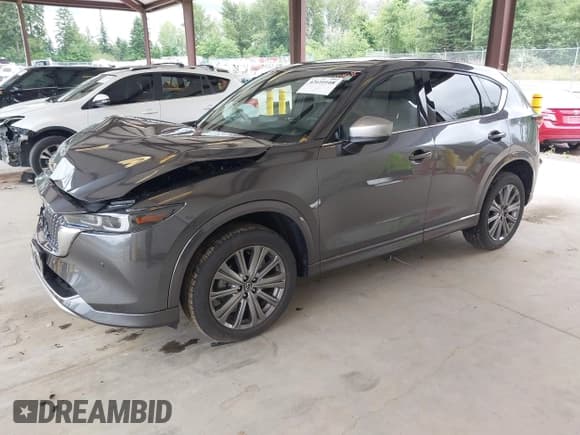 ✅ 2024 Mazda CX-5 Signature • VIN: JM3KFBXYXR0387692 • Lot: 42610108. Listed on IAAI with 15,464 mi. Free auction sales archive from the USA and detailed vehicle history report at DreamBid. Image 2.