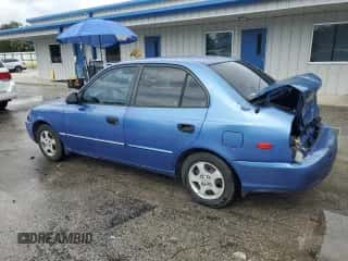 2002 Hyundai Accent GL z VIN KMHCG45C52U288494, wystawiony jako Copart lot #64835465 z przebiegiem 124 538 mil mil oraz Szkoda całkowita • Salvage title. Historia ofert i sprzedaży dostępna na DreamBid. Obrazek 2.