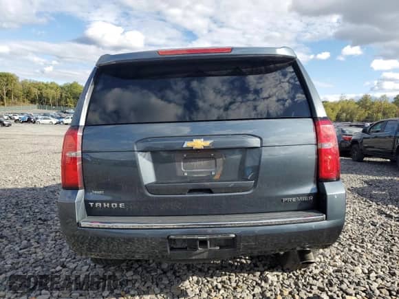2020 Chevrolet Tahoe Premier with VIN 1GNSKCKJ0LR101198, listed as a Copart auction lot 84955895 with 99,414 mi miles and Salvage title. Bid and sale history available at DreamBid. Image 6.