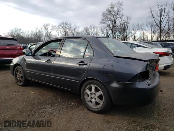 ✅ 2004 Mitsubishi Lancer LS • VIN: JA3AJ36E34U036316 • Lot: 87617655. Listed on Copart with 140,855 mi. Free auction sales archive from the USA and detailed vehicle history report at DreamBid. Image 2.
