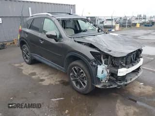 ✅ 2016 Mazda CX-5 Grand Touring • VIN: JM3KE4DY2G0763608 • Lot: 43864275. Wystawiony na IAAI z przebiegiem 95 452 mil. Bezpłatny archiwum sprzedaży aukcyjnych z USA i szczegółowy raport historii pojazdu na DreamBid. Zdjęcie 1.