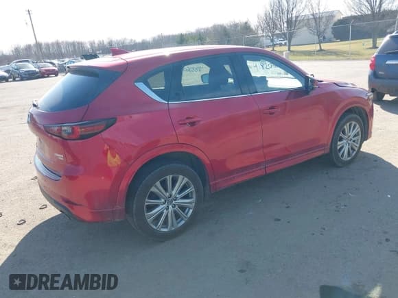 ✅ 2022 Mazda CX-5 Signature • VIN: JM3KFBXY6N0612457 • Lot: 41820607. Listed on IAAI with 51,486 mi. Free auction sales archive from the USA and detailed vehicle history report at DreamBid. Image 4.