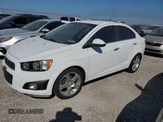 2012 Chevrolet Sonic LTZ z VIN 1G1JE5SH2C4157346, wystawiony jako Copart lot #75705184 z przebiegiem Nie podano mil oraz Szkoda całkowita • Salvage title. Historia ofert i sprzedaży dostępna na DreamBid. Obrazek 1.