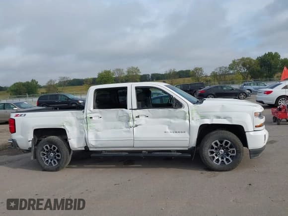 ✅ 2018 Chevrolet Silverado 1500 LT • VIN: 3GCUKREC8JG443934 • Lot: 43266162. Listed on IAAI with 79,404 mi. Free auction sales archive from the USA and detailed vehicle history report at DreamBid. Image 13.