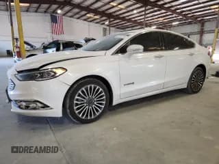 ✅ 2017 Ford Fusion Hybrid Platinum • VIN: 3FA6P0RU5HR388873 • Лот: 92221275. Опубликован ранее на Copart с пробегом 158 256 миль. Бесплатный доступ к архиву аукционных продаж из США и подробный отчёт об истории автомобиля на DreamBid. Изображение 1.