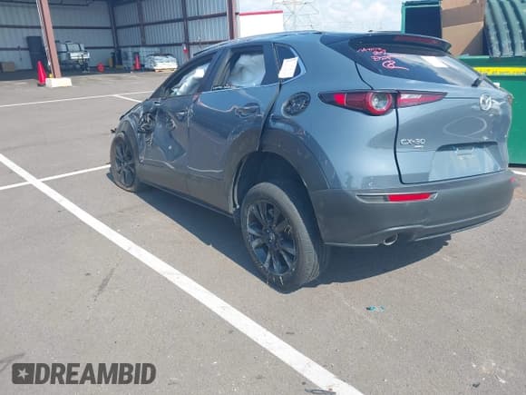 ✅ 2025 Mazda CX-30 S Carbon Edition • VIN: 3MVDMBCM7SM796485 • Лот: 43187011. Опубликован ранее на IAAI с пробегом 15 145 миль. Бесплатный доступ к архиву аукционных продаж из США и подробный отчёт об истории автомобиля на DreamBid. Изображение 3.