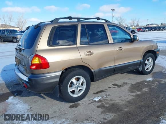 2002 Hyundai Santa Fe GLS z VIN KM8SC73D62U316002, wystawiony jako IAAI lot #41249855 z przebiegiem Nie podano mil oraz . Historia ofert i sprzedaży dostępna na DreamBid. Obrazek 4.
