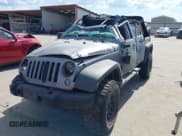 ✅ 2016 Jeep Wrangler Unlimited Sport • VIN: 1C4BJWDG5GL266669 • Lot: 43180650. Listed on IAAI with Not provided. Free auction sales archive from the USA and detailed vehicle history report at DreamBid. Image 2.