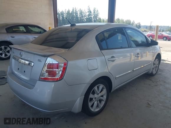 ✅ 2011 Nissan Sentra S • VIN: 3N1AB6AP1BL612102 • Lot: 43131246. Listed on IAAI with 128,396 mi. Free auction sales archive from the USA and detailed vehicle history report at DreamBid. Image 4.