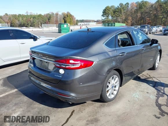 ✅ 2017 Ford Fusion Hybrid SE • VIN: 3FA6P0LU8HR260068 • Lot: 43685195. Listed on IAAI with 211,056 mi. Free auction sales archive from the USA and detailed vehicle history report at DreamBid. Image 4.