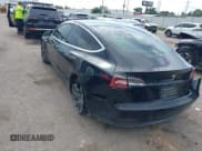 ✅ 2019 Tesla Model 3 Mid Range • VIN: 5YJ3E1EA7KF394509 • Lot: 42574495. Listed on IAAI with 76,334 mi. Free auction sales archive from the USA and detailed vehicle history report at DreamBid. Image 3.