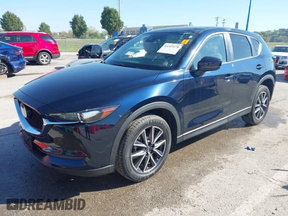 ✅ 2018 Mazda CX-5 Touring • VIN: JM3KFACM5J1473522 • Lot: 43315278. Listed on IAAI with 56,327 mi. Free auction sales archive from the USA and detailed vehicle history report at DreamBid. Image 2.