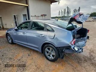 ✅ 2023 Kia K5 LXS • VIN: 5XXG14J23PG211897 • Лот: 84238815. Опубликован ранее на Copart с пробегом 37 762 миль. Бесплатный доступ к архиву аукционных продаж из США и подробный отчёт об истории автомобиля на DreamBid. Изображение 2.