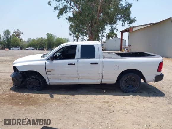 ✅ 2019 Ram 1500 Tradesman • VIN: 1C6RR6FG2KS719656 • Lot: 42737371. Listed on IAAI with 131,256 mi. Free auction sales archive from the USA and detailed vehicle history report at DreamBid. Image 14.