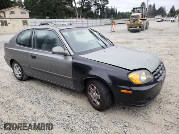 2004 Hyundai Accent GL with VIN KMHCG35C44U299645, listed as a Copart auction lot 63728174 with 159,604 mi miles and Clean title. Bid and sale history available at DreamBid. Image 4.